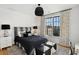 Spacious bedroom with black and white bedding, large windows and a cozy atmosphere at 6870 Colfax Ave, Cumming, GA 30040