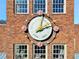 Ornate clock on brick building at 6870 Colfax Ave, Cumming, GA 30040