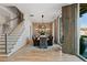 Formal dining room with exposed brick wall and large windows at 6870 Colfax Ave, Cumming, GA 30040