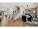 Elegant dining room featuring hardwood floors and a statement brick wall at 6870 Colfax Ave, Cumming, GA 30040