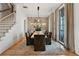 Elegant dining room with large windows and a rustic table at 6870 Colfax Ave, Cumming, GA 30040