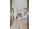 Elegant entryway with hardwood floors and view to the living room at 6870 Colfax Ave, Cumming, GA 30040