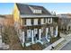 Two-story white home with dark brown accents, balconies, and a covered porch at 6870 Colfax Ave, Cumming, GA 30040
