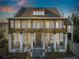 Stunning two-story home with a charming front porch and landscaped yard at 6870 Colfax Ave, Cumming, GA 30040