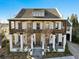 Two story home with a large covered porch and a metal roof at 6870 Colfax Ave, Cumming, GA 30040