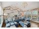 Spacious Gathering room boasts a sectional sofa, large windows, and stylish wallcovering at 6870 Colfax Ave, Cumming, GA 30040