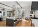 Spacious kitchen with large island, built-in appliances, and herringbone hardwood floors at 6870 Colfax Ave, Cumming, GA 30040