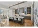 Modern kitchen with gray cabinets, marble island, and herringbone floors at 6870 Colfax Ave, Cumming, GA 30040