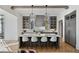 Modern kitchen with gray cabinets, marble island, and herringbone floors at 6870 Colfax Ave, Cumming, GA 30040