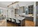 Modern kitchen with gray cabinets, marble island, and herringbone floors at 6870 Colfax Ave, Cumming, GA 30040