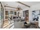 Open living room with kitchen views, hardwood floors, and ample seating at 6870 Colfax Ave, Cumming, GA 30040