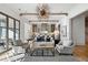 Open living room with kitchen views, hardwood floors, and ample seating at 6870 Colfax Ave, Cumming, GA 30040