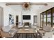 Bright living room with hardwood floors, fireplace, and comfortable seating at 6870 Colfax Ave, Cumming, GA 30040