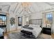 Luxurious main bedroom with high ceilings, large windows, and a cozy sitting area at 6870 Colfax Ave, Cumming, GA 30040