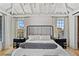 Luxurious main bedroom with high ceilings, large windows, and a cozy sitting area at 6870 Colfax Ave, Cumming, GA 30040