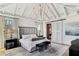 Luxurious main bedroom with high ceilings, large windows, and a cozy sitting area at 6870 Colfax Ave, Cumming, GA 30040