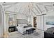 Luxurious main bedroom with high ceilings, large windows, and a cozy sitting area at 6870 Colfax Ave, Cumming, GA 30040