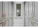 Walk-in pantry with ample storage space and gray cabinets at 6870 Colfax Ave, Cumming, GA 30040