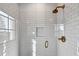 Spacious walk-in shower with white subway tile and gold fixtures at 6870 Colfax Ave, Cumming, GA 30040