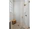 Large walk-in shower with white tile and a built-in bench at 6870 Colfax Ave, Cumming, GA 30040