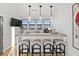 Stylish wet bar featuring a live-edge wood countertop and bar stools at 6870 Colfax Ave, Cumming, GA 30040
