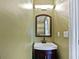 Small bathroom with a pedestal sink and vanity at 1043 Carriage Trace Cir, Stone Mountain, GA 30087