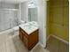 Clean bathroom with shower, toilet, vanity, and a linen closet at 1043 Carriage Trace Cir, Stone Mountain, GA 30087