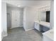 Main bathroom with double vanity and tile flooring at 1043 Carriage Trace Cir, Stone Mountain, GA 30087
