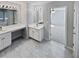 Main bathroom with double vanity and tile floors at 1043 Carriage Trace Cir, Stone Mountain, GA 30087