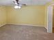 Spacious bedroom with neutral carpeting and ceiling fan at 1043 Carriage Trace Cir, Stone Mountain, GA 30087