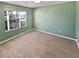 Bedroom with light green walls and neutral carpeting at 1043 Carriage Trace Cir, Stone Mountain, GA 30087