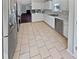 Modern kitchen with stainless steel appliances and tile floor at 1043 Carriage Trace Cir, Stone Mountain, GA 30087