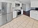 Modern kitchen with stainless steel appliances and white cabinets at 1043 Carriage Trace Cir, Stone Mountain, GA 30087