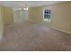 Large living room with carpet and neutral yellow color scheme and open layout at 1043 Carriage Trace Cir, Stone Mountain, GA 30087