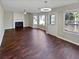 Bright living room featuring hardwood floors and a fireplace at 1043 Carriage Trace Cir, Stone Mountain, GA 30087