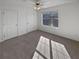 Spacious bedroom with large window and neutral carpeting at 1043 Carriage Trace Cir, Stone Mountain, GA 30087