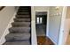 Staircase and view into the living area from the foyer at 2002 Pat Mell Se Pl, Smyrna, GA 30080