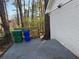 Small backyard patio with green and blue bins at 3705 Daisy Dr, Decatur, GA 30032