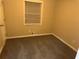 Small bedroom with neutral walls and carpeting at 3705 Daisy Dr, Decatur, GA 30032