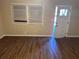 Living room with hardwood floors and open door at 3705 Daisy Dr, Decatur, GA 30032