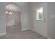 Bright entryway with hardwood floors, arched entry to dining room, and white front door at 396 Ajo Way, Dallas, GA 30157