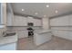 Modern kitchen with white cabinets, granite countertops, and stainless steel appliances at 396 Ajo Way, Dallas, GA 30157