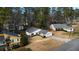 Aerial view of a quiet residential neighborhood with houses and trees at 670 Lake Forest Ct, Roswell, GA 30076