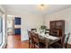 Dining area with dark wood table and chairs, kitchen view at 670 Lake Forest Ct, Roswell, GA 30076