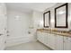 Elegant bathroom with double vanity, soaking tub, and large mirrors at 2795 Peachtree Ne Rd # 703, Atlanta, GA 30305