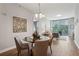 Elegant dining room with hardwood floors and a glass-top table at 2795 Peachtree Ne Rd # 703, Atlanta, GA 30305