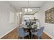 Modern dining area with hardwood floors and a round table for four at 2795 Peachtree Ne Rd # 703, Atlanta, GA 30305
