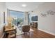 Open living space with hardwood floors and large windows at 2795 Peachtree Ne Rd # 703, Atlanta, GA 30305