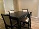 Dining area with four chairs and a dark wood table at 63 Tiburon Dr # 63, Lithonia, GA 30038