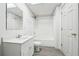 Basement bathroom with tub, toilet and vanity at 2234 Oak Falls Ln, Buford, GA 30519